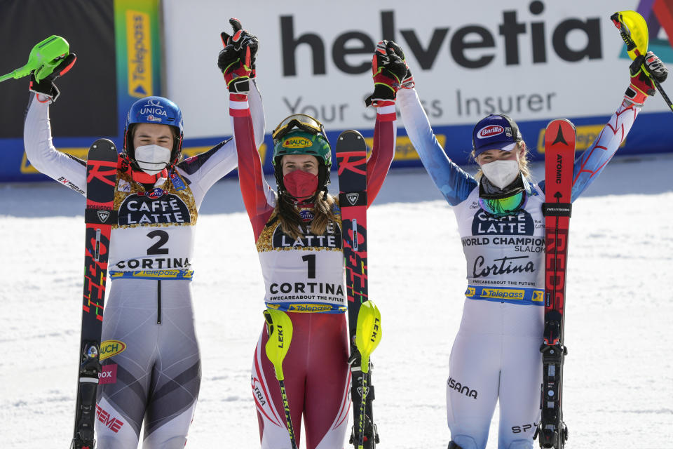 Austria's Katharina Liensberger, center, winner of the women's slalom, poses with second placed Slovakia's Petra Vlhova, left, and third placed United States' Mikaela Shiffrin, at the alpine ski World Championships in Cortina d'Ampezzo, Italy, Saturday, Feb. 20, 2021. (AP Photo/Giovanni Auletta)
