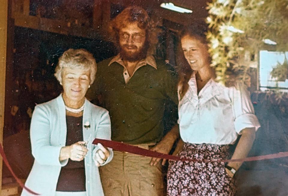From the left, York mayor Betty Marshall cuts a ribbon with Steve and Liz Winand, opening their first store on South Pershing Street in York in 1978.