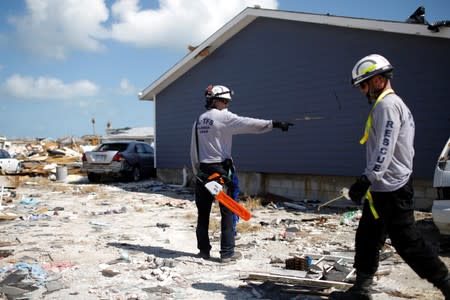 Personnel from the Florida Search & Rescue Task Force search for the dead in the destroyed the Mudd neighbourhood after Hurricane Dorian hit the Abaco Islands in Marsh Harbour