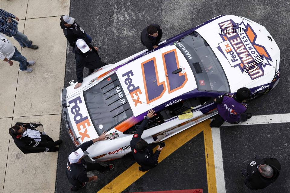 NASCAR Cup Series driver Denny Hamlin's car is moved before a NASCAR Cup Series auto race at Talladega Superspeedway, Sunday, April 21, 2024, in Talladega. Ala. (AP Photo/Butch Dill)