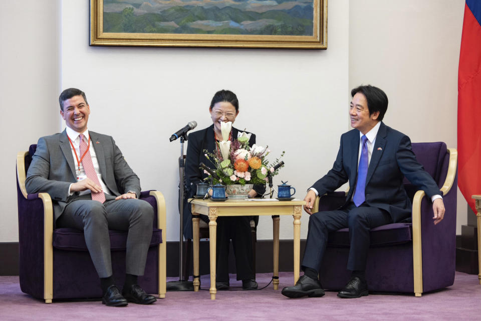 In this photo released by the Taiwan Presidential Office, Paraguay's president-elect Santiago Pena, left, and Taiwan's Vice President in William Lai react during a meeting in Taipei, Taiwan, Wednesday, July 12, 2023. (Taiwan Presidential Office via AP)