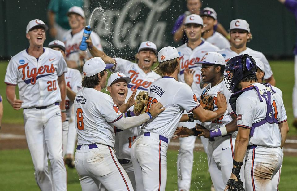 Clemson junior Austin Gordon (56) reacts with catcher Jimmy Obertop (11) after helping beat Coastal Carolina University at the NCAA baseball Clemson Regional at Doug Kingsmore Stadium in Clemson Sunday, June 2, 2024.