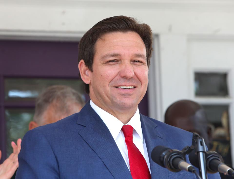 Florida governor Ron DeSantis smiles as he walks out to speaks about money he is allocating for infrastructure improvements around Florida, on the front porch of the Ivy House Restaurant in Williston, April 29, 2022.   [Brad McClenny/The Gainesville Sun]