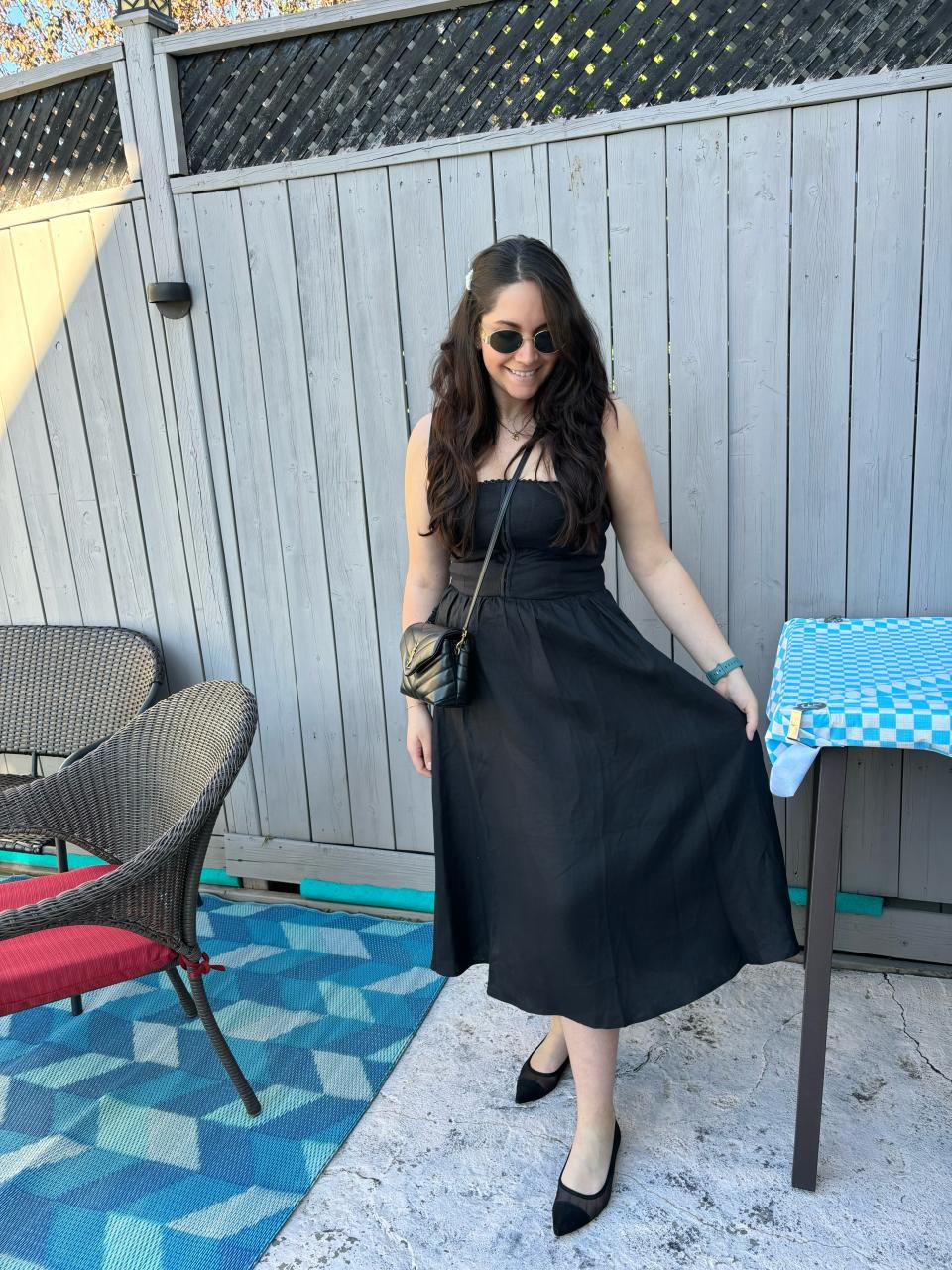 Melina wearing The Reformation Tagliatelle Linen Dress in Black