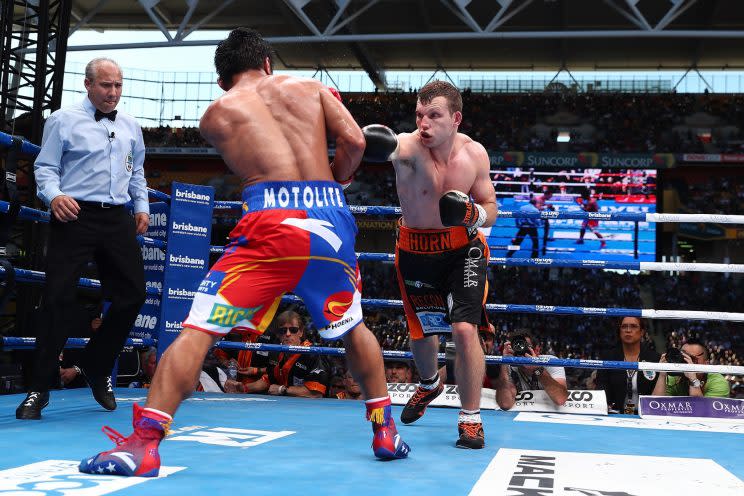 Jeff Horn (R) punches Manny Pacquiao during their bout Saturday for the WBO welterweight title in Brisbane, Australia. (Getty Images)