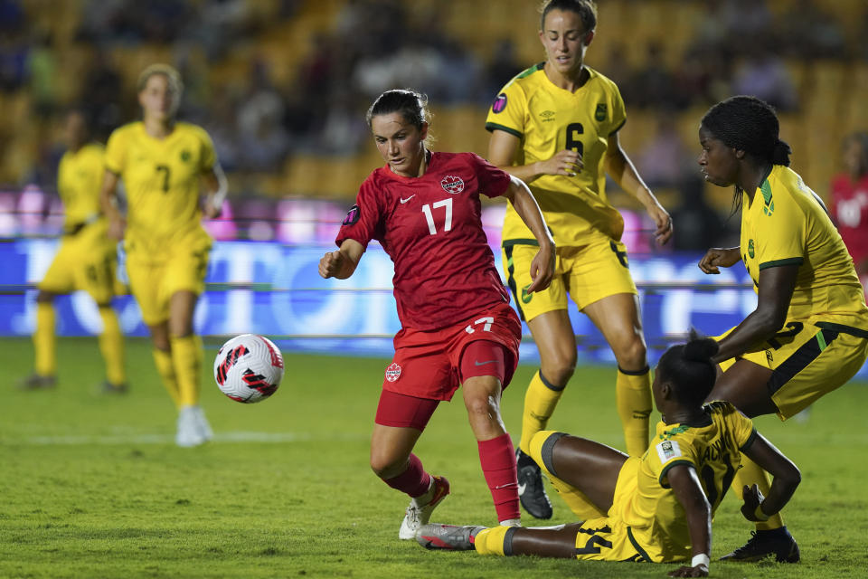 Jamaica's Deneisha Blackwood, bottom, and Vyan Sampson challenge Canada's Jessie Fleming (17) during a CONCACAF Women's Championship soccer semifinal match in Monterrey, Mexico, Thursday, July 14, 2022. (AP Photo/Fernando Llano)