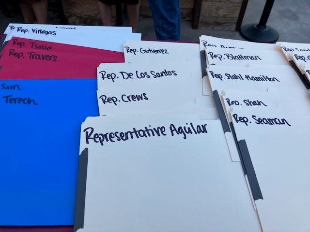 Folders set up to accept contributions to Democratic lawmakers at a Phoenix fundraiser.