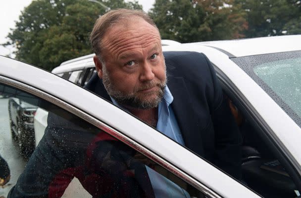 PHOTO: Conspiracy theorist Alex Jones enters a private car after talking to the media outside State of Connecticut Superior Court during the Sandy Hook hoax defamation trialin Waterbury Conn., Oct. 4, 2022 .  (Douglas Healey/Polaris)