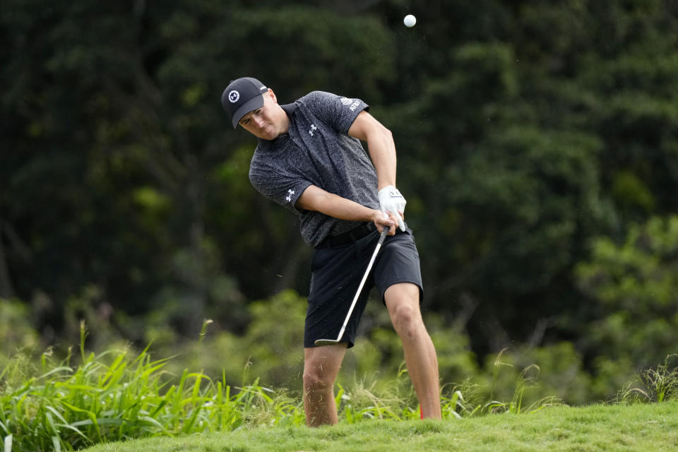 Jordan Spieth hits his approach from the rough along the 18th green during the Tournament of Champions pro-am golf event, Wednesday, Jan. 4, 2023, at Kapalua Plantation Course in Kapalua, Hawaii. (AP Photo/Matt York)