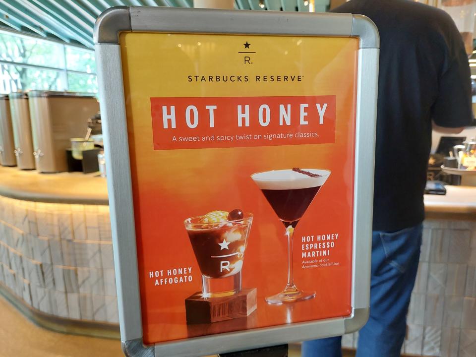 A board at the Starbucks Reserve Roastery in Chicago advertising two hot honey drinks - an affogato and an espresso martini