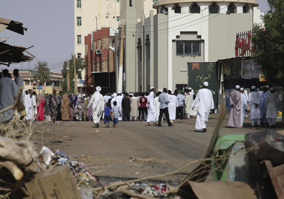 Worshippers gather at a mosque behind a roadblock set by protesters on a main street in the Sudanese capital Khartoum to stop military vehicles from driving through the area on Wednesday, June 5, 2019. The death toll in Sudan amid a violent crackdown on pro-democracy protesters and the dispersal of their peaceful sit-in earlier this week in the capital climbed on Wednesday, protest organizers said. (AP Photo)