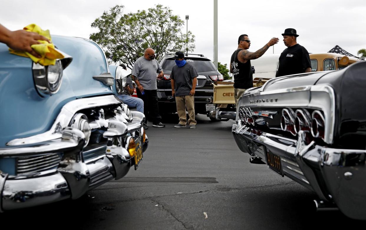 Car clubs meet before a drive along the historic Whittier Boulevard on Sunday, June 28, 2020.