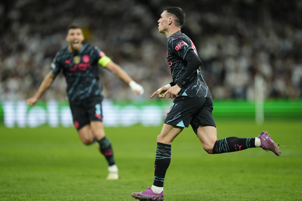 Manchester City's Phil Foden celebrates after scoring his side's second goal during the Champions League quarterfinal first leg soccer match between Real Madrid and Manchester City at the Santiago Bernabeu stadium in Madrid, Spain, Tuesday, April 9, 2024. (AP Photo/Jose Breton)