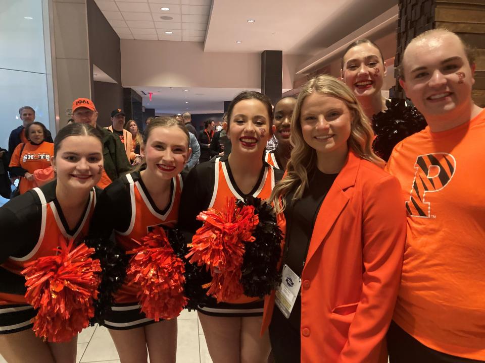 Princeton cheerleading coach Claudia Ralph (second from right) with members of her cheer squad during a Sweet 16 pregame pep rally