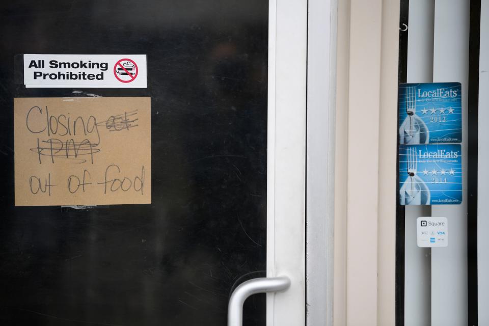 A sign reads "Closing at 1pm out of food" at the front door at Rankin Restaurant, 2200 Central St., in Knoxville, Tenn. on Tuesday, Feb. 22, 2022. The longtime restaurant closed its doors after 69 years in business.