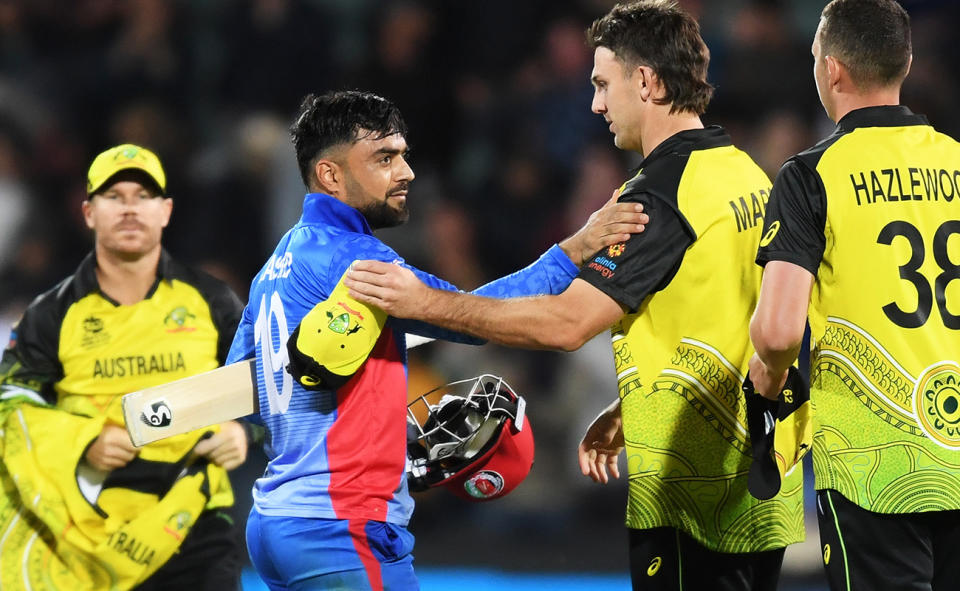 Rashid Khan, pictured here shaking hands with Aussie players after Afghanistan's clash with Australia at the T20 World Cup.