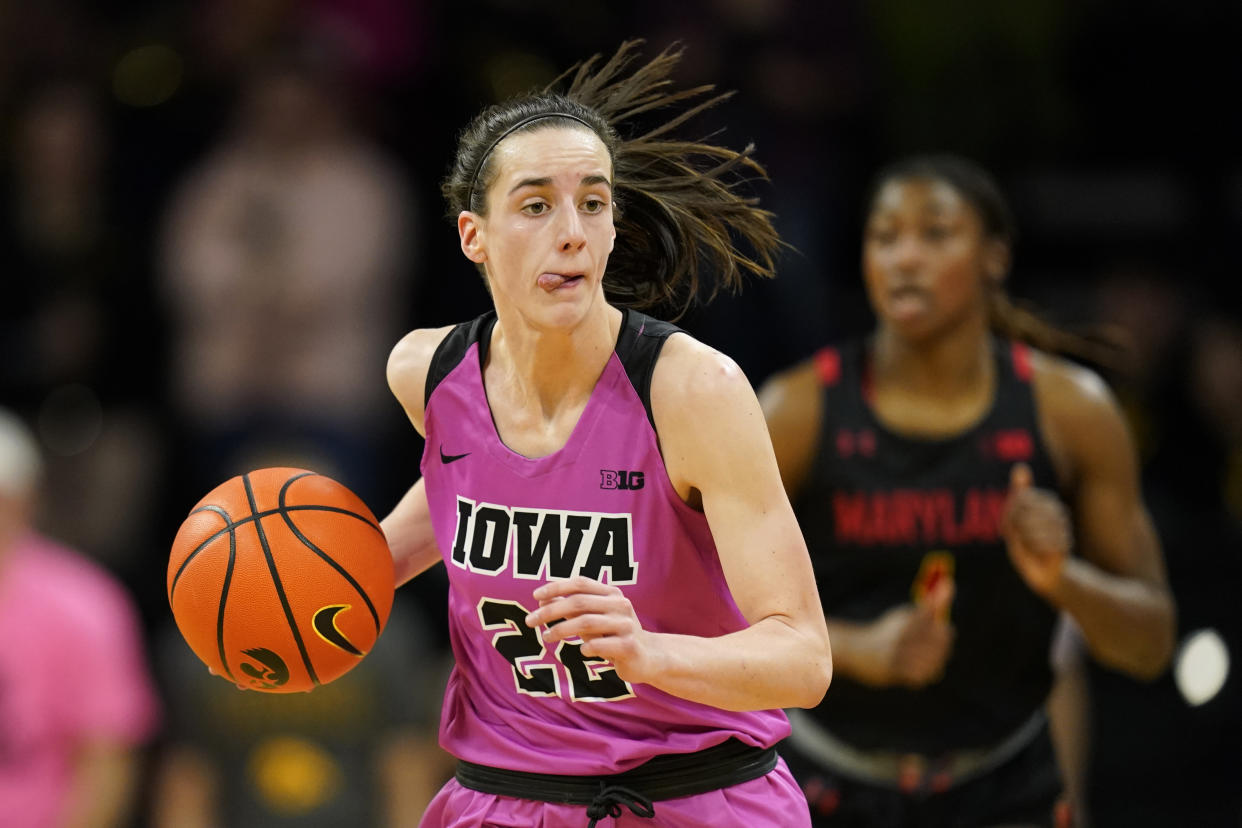 Iowa guard Caitlin Clark drives up court during the second half of an NCAA college basketball game against Maryland, Monday, Feb. 14, 2022, in Iowa City, Iowa. Maryland won 81-69. (AP Photo/Charlie Neibergall)