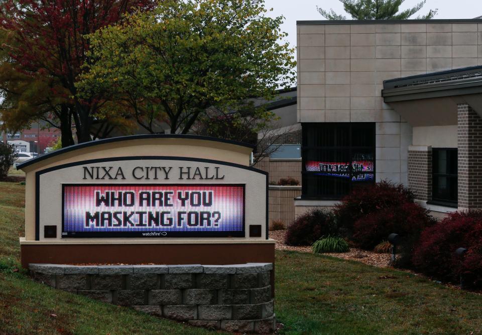 A display board encourages mask-wearing outside Nixa City Hall on Oct. 20. 2020, in Nixa, Mo.