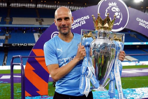 Manchester City manager Pep Guardiola with-2021/22 Premier League trophy