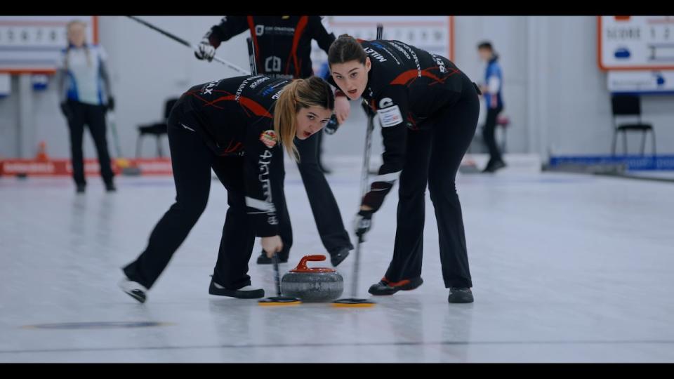 Curling teammates Brook and Hannah appear in a still from Curl Power.