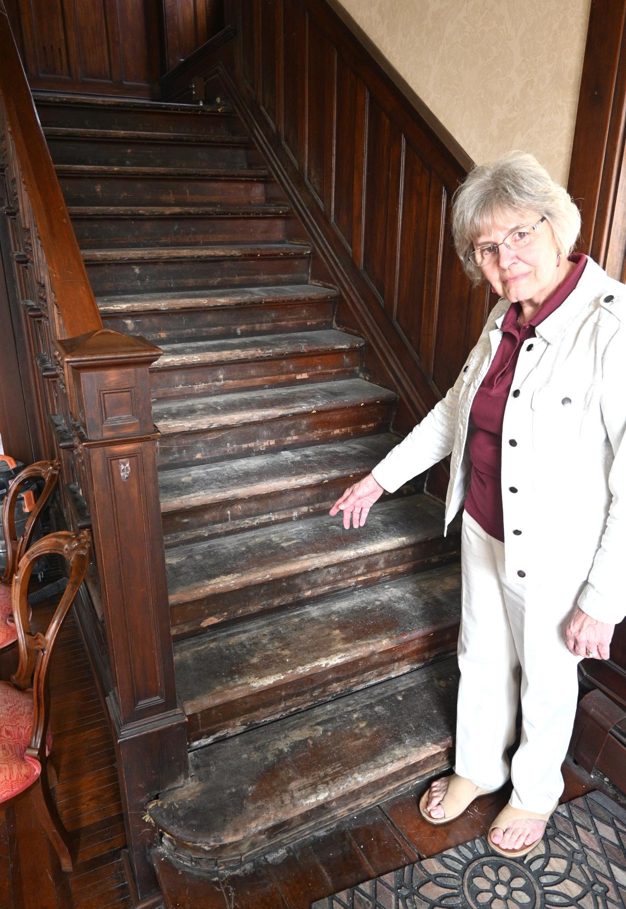 Kathie Bappert shows the stairs to the second story that need restoration.