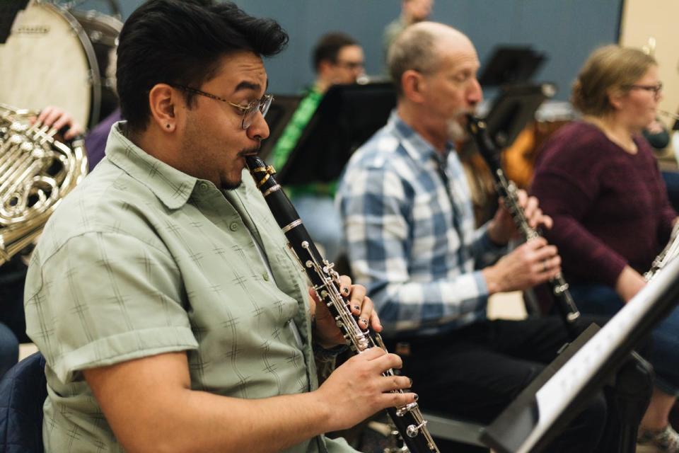 Bloomington Symphony Orchestra members practicing include, from left, Roberto Ortiz, Carl Weinberg (clarinet) and Katie Mills playing the bassoon.