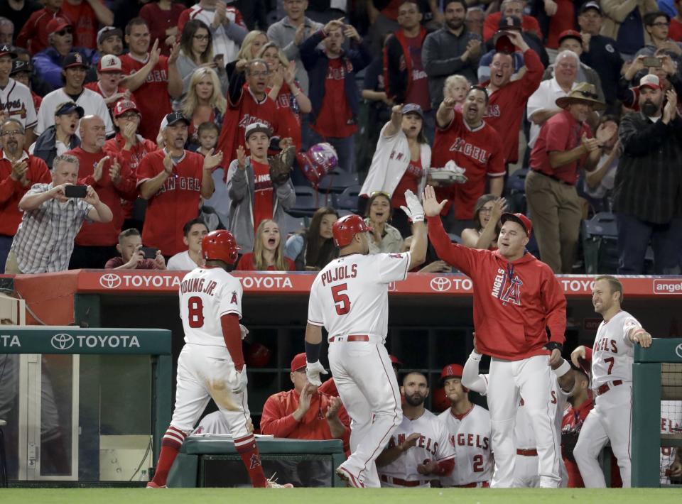 Albert Pujols celebrates homer No. 599. (AP)