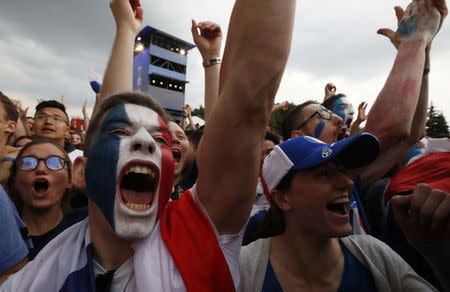 Soccer Football - World Cup - Final - France v Croatia - FIFA Fan Fest, Moscow, Russia - July 15, 2018 Supporters of team France react during the game. REUTERS/Sergei Karpukhin