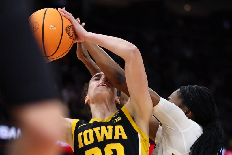 CLEVELAND, OHIO – APRIL 07: Caitlin Clark #22 of the Iowa Hawkeyes works to shoot over Bree Hall #23 of the South Carolina Gamecocks in the second half during the 2024 NCAA Women’s Basketball Tournament National Championship at Rocket Mortgage FieldHouse on April 07, 2024 in Cleveland, Ohio. (Photo by Steph Chambers/Getty Images)