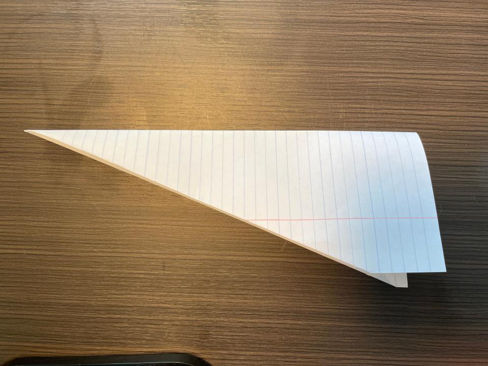 How to make a paper airplane step four