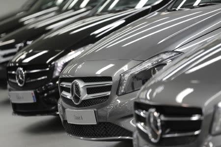 Mercedes-Benz A-class cars are displayed in a dealership of German car manufacturer Daimler in Paris, July 30, 2013. REUTERS/Christian Hartmann