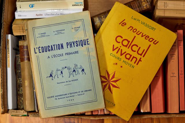 <p>MANUEL LAGOS CID/PARIS MATCH/GETTY IMAGES</p> Vintage volumes for sale at the bookshop La Rose des Vents.