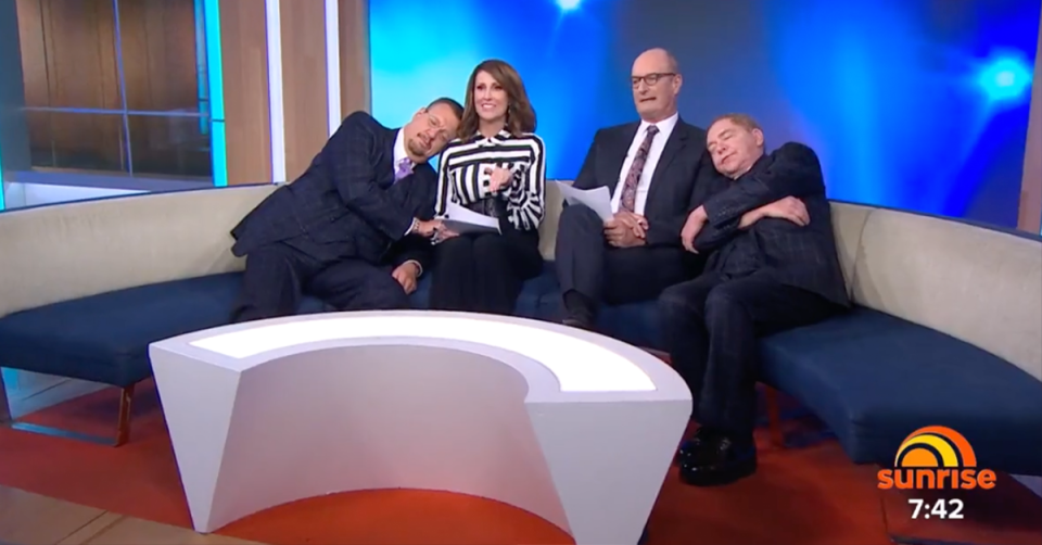 Penn & Teller asleep on Nat Barr and Kochie's shoulders on Sunrise.