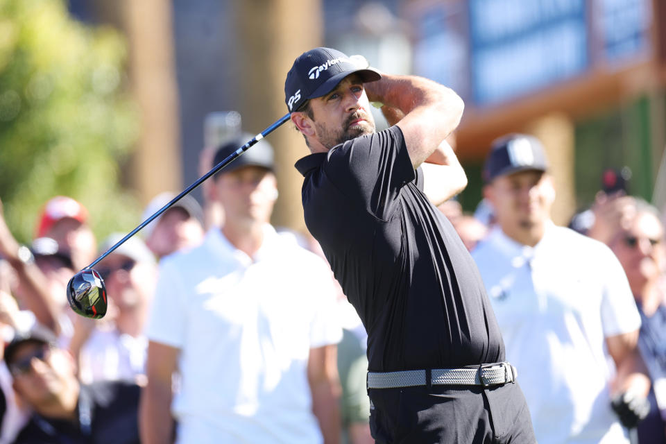 Aaron Rodgers plays a shot during Capital One's The Match VI