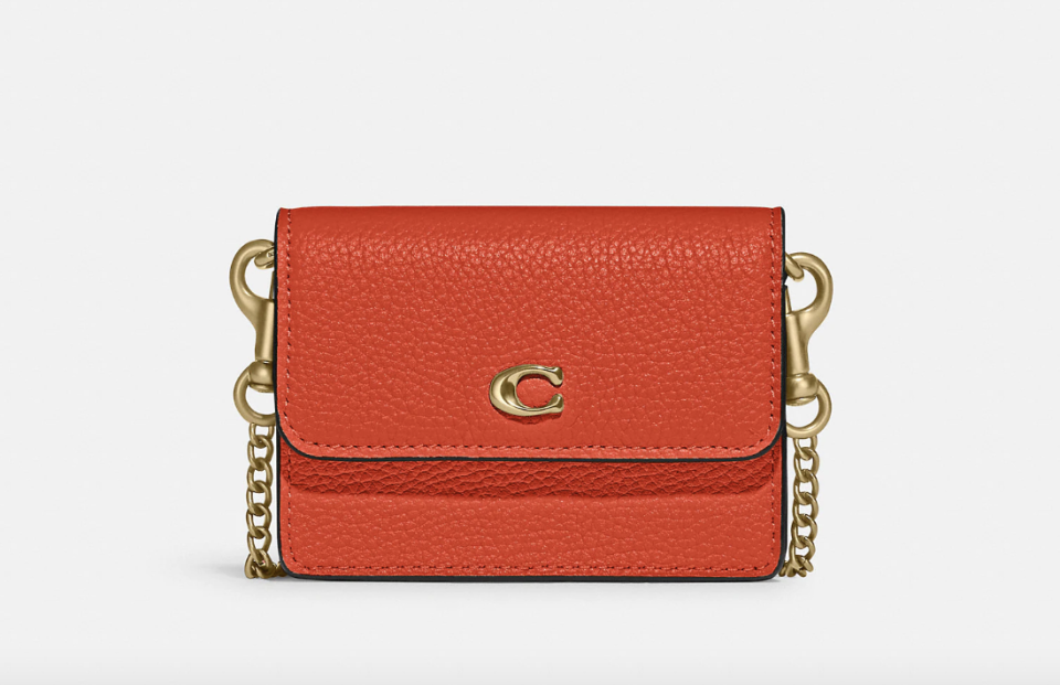 Coach Half Flap Card Case in B4/Red Orange (Photo via Coach)