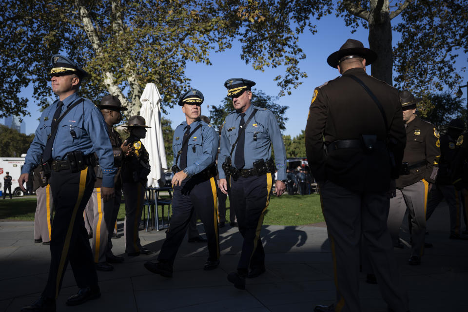 Law enforcement officers gather for a viewing for officer Richard Mendez at the Cathedral Basilica of Saints Peter and Paul in Philadelphia, Tuesday, Oct. 24, 2023. Mendez was shot and killed, and a second officer was wounded when they confronted people breaking into a car at Philadelphia International Airport, Thursday, Oct. 12, 2023, police said. (AP Photo/Joe Lamberti)