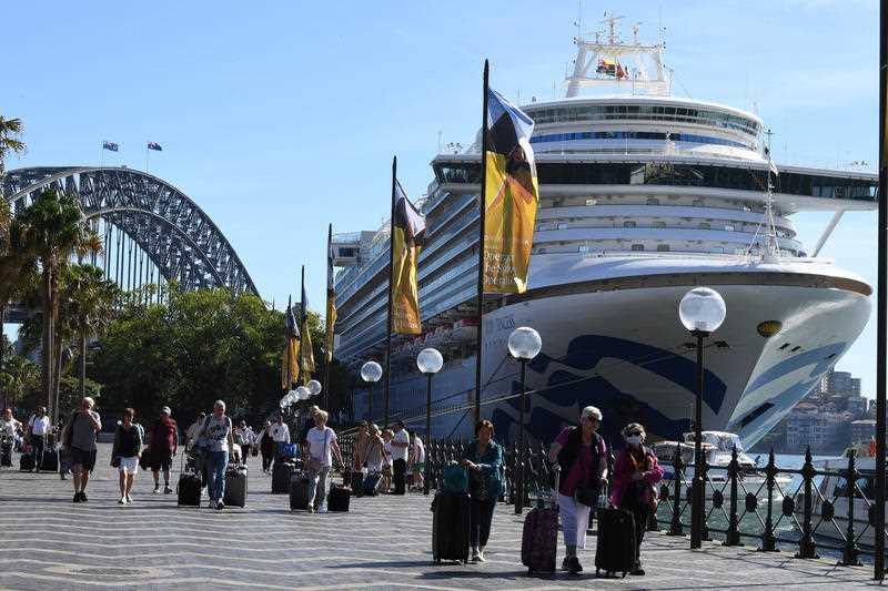 Cruise ship passengers disembark from the Princess Cruises owned Ruby Princess at Circular Quay in Sydney.