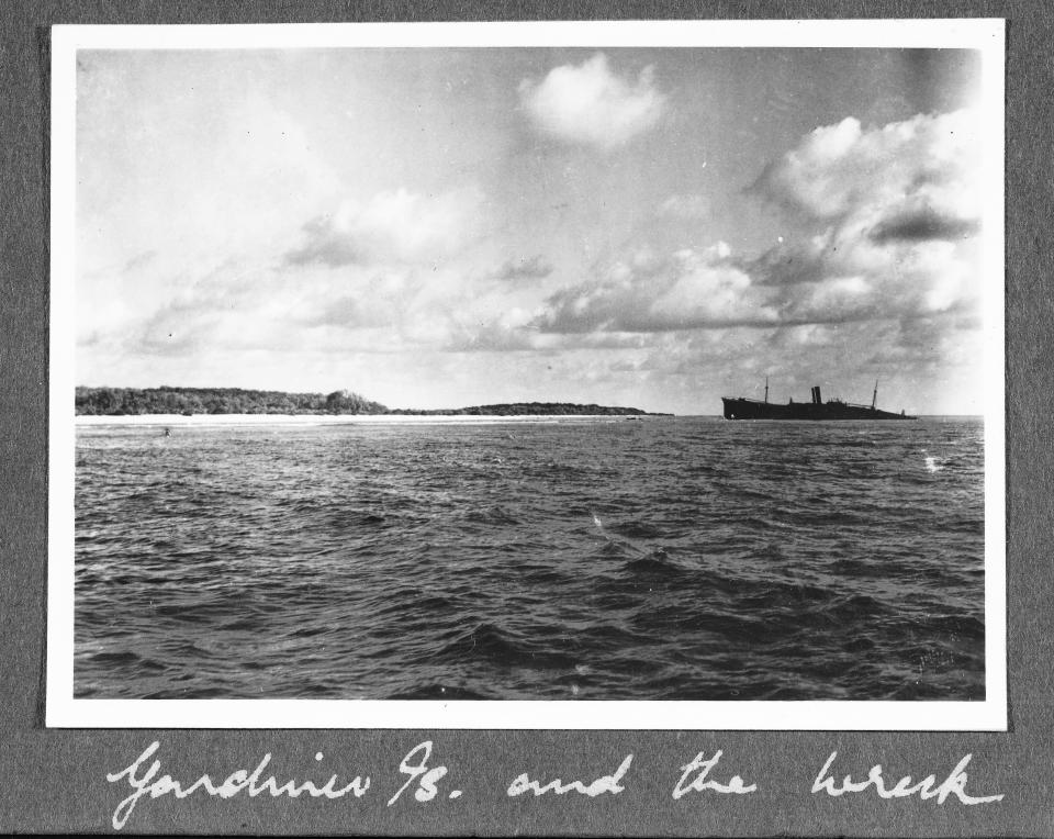 This image provided by The International Group for Historic Aircraft Recovery and displayed at a U.S. State Department news conference on Tuesday, March 20, 2012, may provide a new clue in one of the 20th century's most enduring mysteries and could soon help uncover the fate of American aviator Amelia Earhart, who went missing without a trace over the South Pacific 75 years ago, investigators said. Enhanced analysis of a photograph taken just months after Earhart's Lockheed Electra plane vanished shows what experts think may be the landing gear of the aircraft, the small black object on the left side of the image, protruding from the waters off the remote island of Nikumaroro, in what is now the Pacific nation of Kiribati. Armed with that analysis by the State Department, historians, scientists and salvagers from The International Group for Historic Aircraft Recovery, are returning to the island in July 2012 in the hope of finding the wreckage of Earhart's plane and perhaps even the remains of the pilot and her navigator Fred Noonan. (AP Photo/The International Group for Historic Aircraft Recovery)