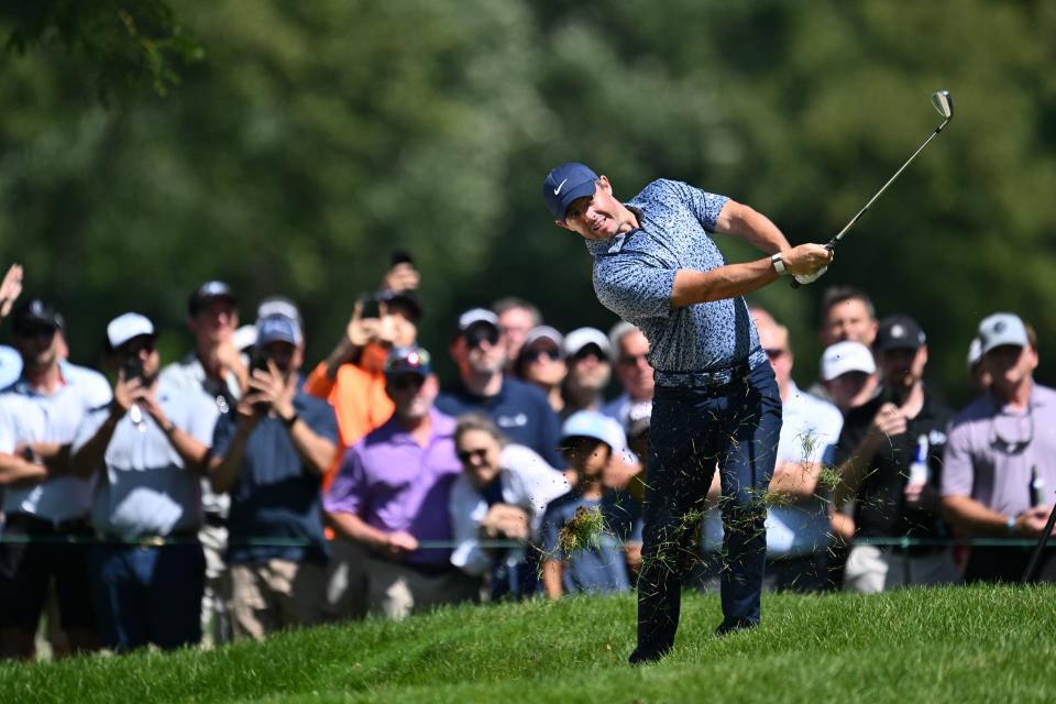 Aug 17, 2023; Olympia Fields, Illinois, USA; Rory McIlroy hits out of the rough on the ninth fairway during the first round of the BMW Championship golf tournament.