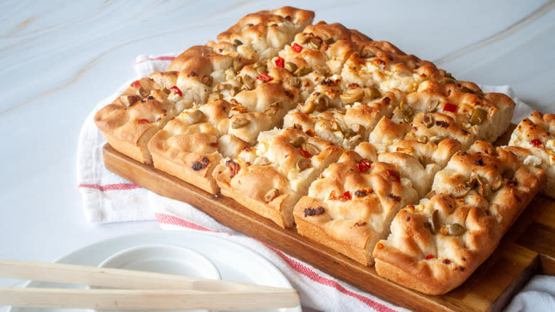 Focaccia bread on board cut in squares