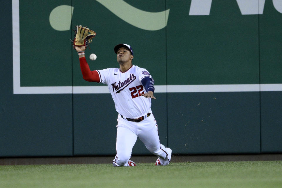 Washington Nationals right fielder Juan Soto cannot make a catch on a ball that went for a double by Los Angeles Dodgers' Mookie Betts during the fourth inning of a baseball game Monday, May 23, 2022, in Washington. (AP Photo/Nick Wass)