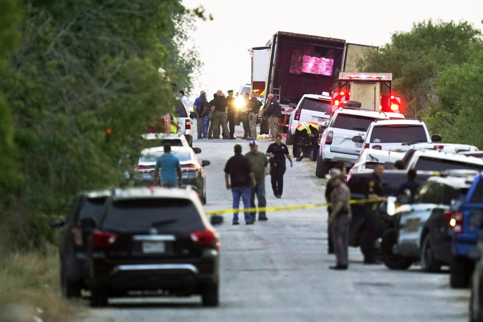 Police and other first responders work the scene where officials say dozens of people have been found dead and multiple others were taken to hospitals with heat-related illnesses after a semitrailer containing suspected migrants was found, Monday, June 27, 2022, in San Antonio. (Eric Gay / AP file)