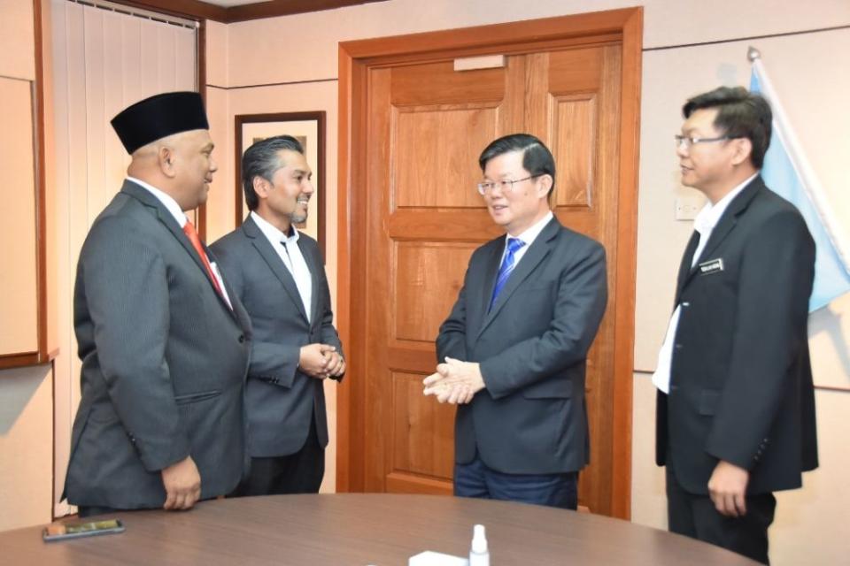Bertam assemblyman Khaliq Mehtab Mohd Ishaq (second from left) and Teluk Bahang assemblyman Zolkifly Md Lazim (left) speaks to Penang Chief Minister Chow Kon Yeow in Komtar, George Town February 27, 2020. ― Picture courtesy of the Penang CM's Office