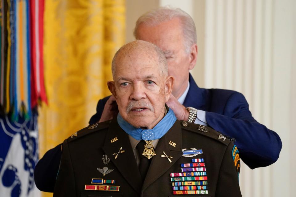 President Joe Biden awards the Medal of Honor to retired Army Col. Paris Davis for his heroism during the Vietnam War, in the East Room of the White House on Friday in Washington