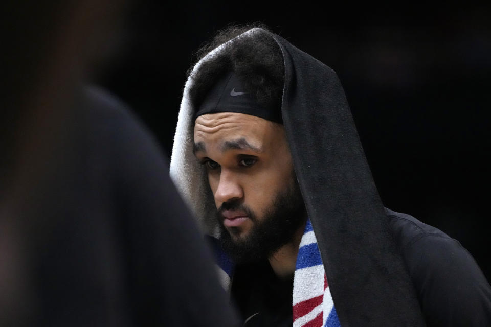 Boston Celtics guard Derrick White walks to the bench after being take out of the game in the closing minutes of the second half in Game 7 of the NBA basketball Eastern Conference finals Monday, May 29, 2023, in Boston. (AP Photo/Charles Krupa )