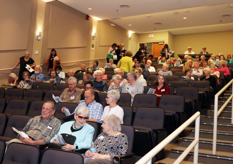 The crowd begins to file in at Oak Ridge Associated Universities' Pollard Auditorium for the "Roots of America" talk on hate crimes from FBI Special Agent Andy Crabtree.