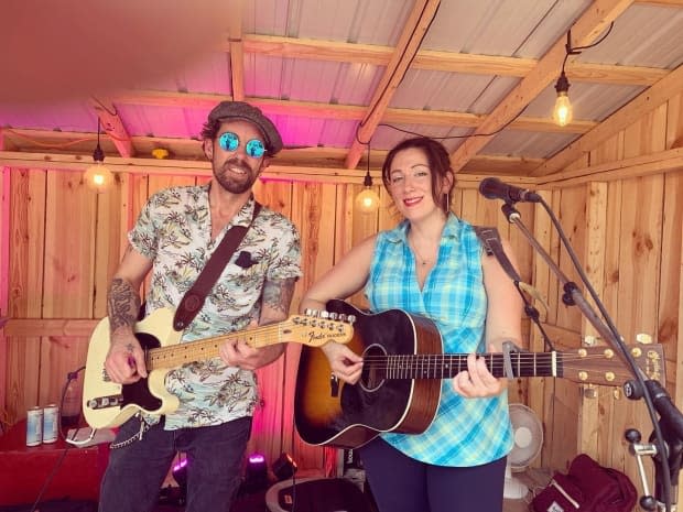 Blair Michael Hogan, left, and Julie Corrigan took the stage at an outdoor concert presented by the TD Ottawa Jazz Festival in August.  (Submitted by Julie Corrigan - image credit)