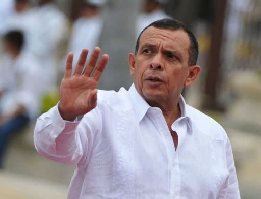 Honduras' President Porfiro Lobo waves upon his arrival at the Summit of the Americas in Cartagena, Colombia. Leaders from across the Americas launched talks Saturday on expanding trade but were split on alternatives to the failing war on illegal drug trafficking, and on relations with Cuba