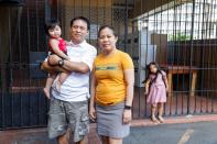 Judith and Jose Ramirez pose with their daughters outside their home in Honolulu