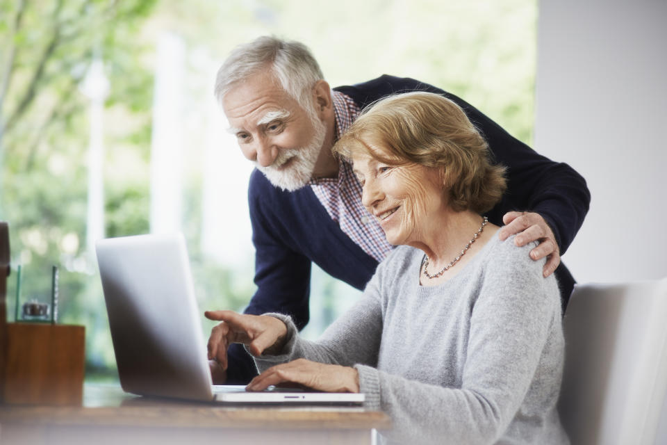 Retired couple looking at laptop computer